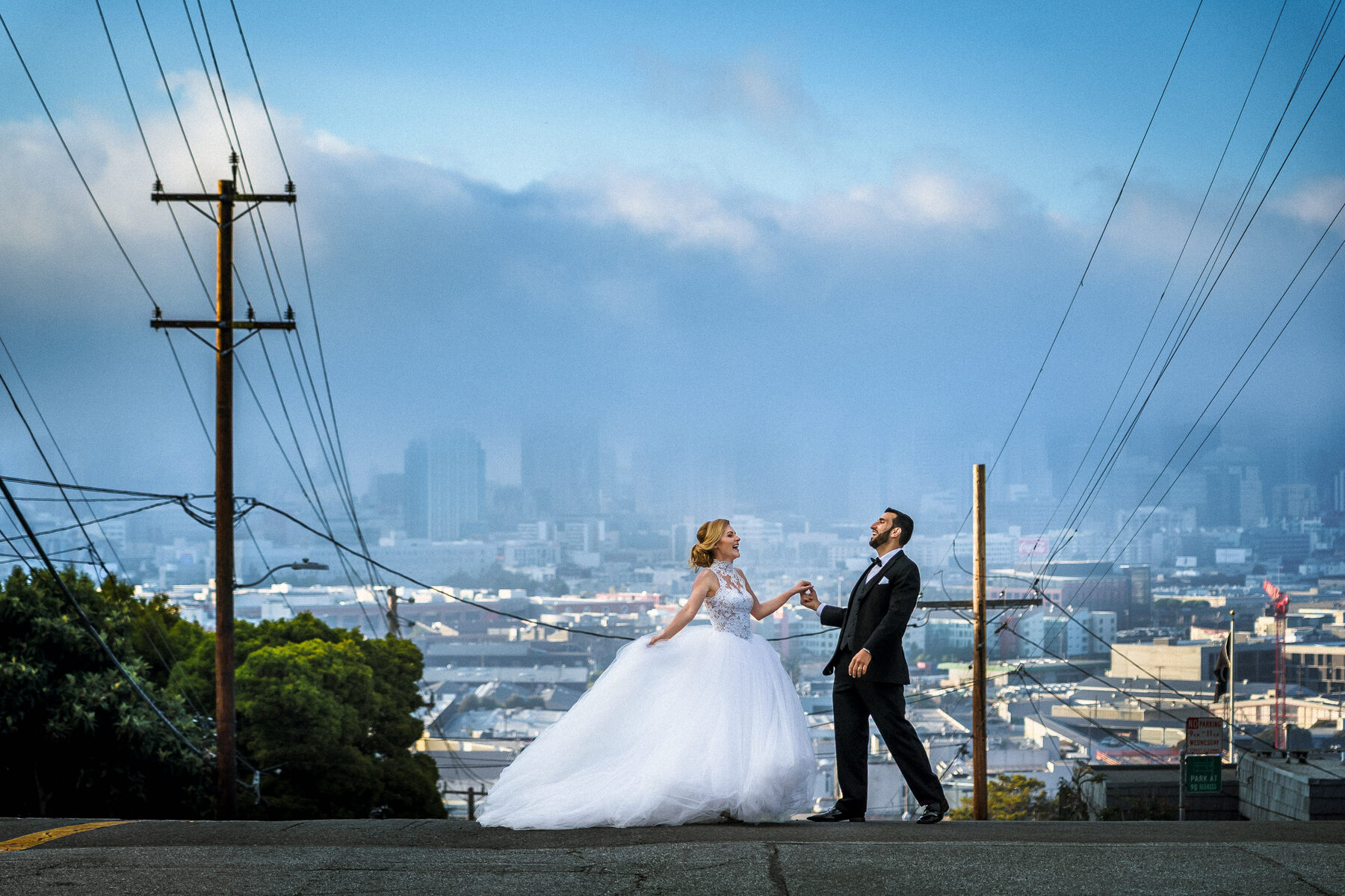Bride and groom overlooking the San Francisco skyline from Potrero Hill