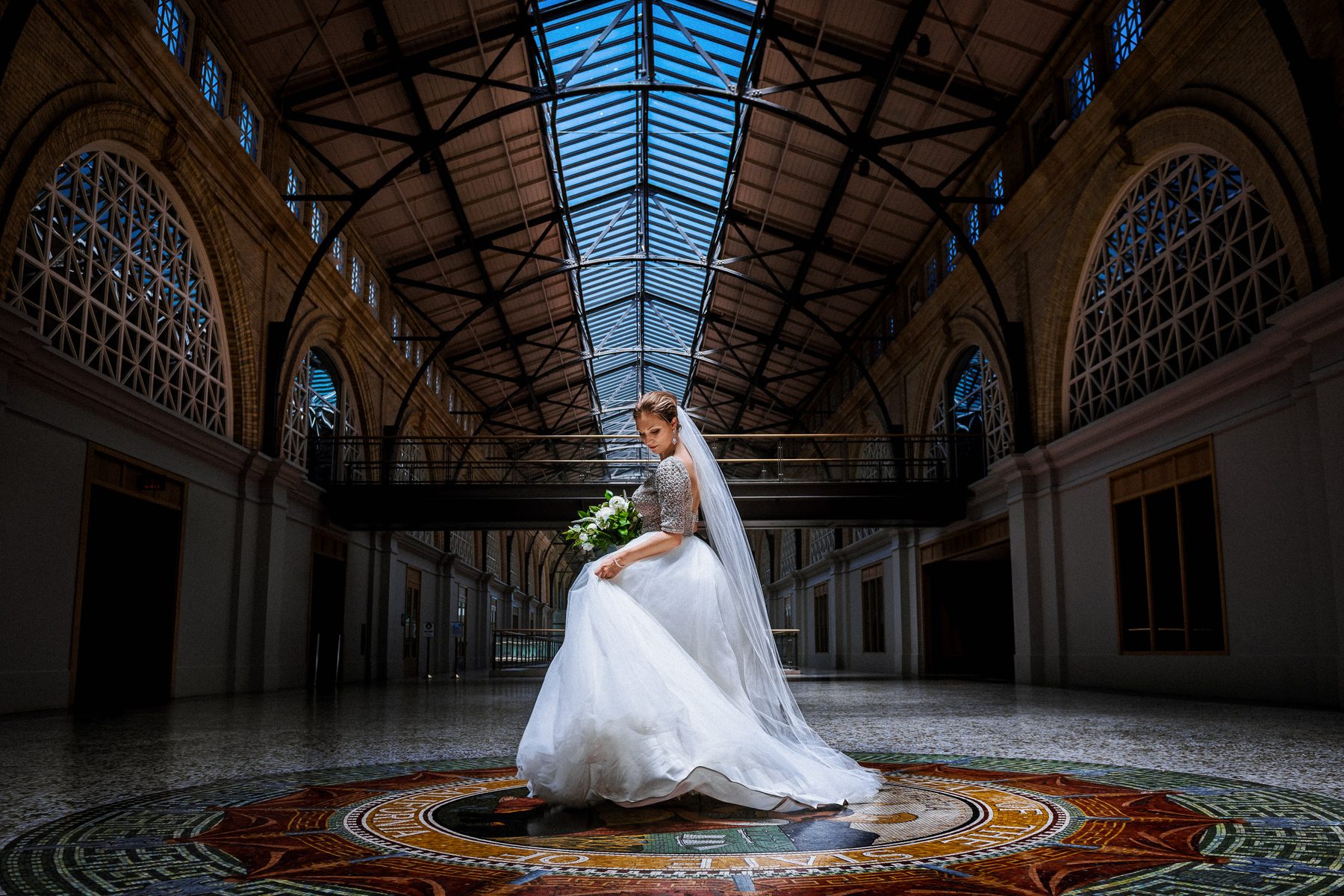 Bride beneath the glass roof of the San Francisco Ferry Building before her St. George Spirits wedding